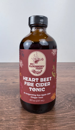 Heart Beet Fire Cider Tonic in 8 oz glass bottle with herbal apple cider vinegar blend for seasonal wellness and circulation support – JSQ Mercantile – a women’s boutique and gift shop in La Grange, IL.