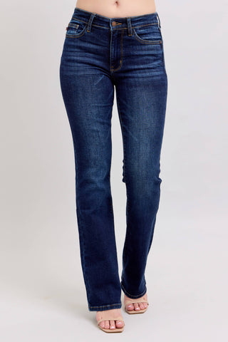 Blue jeans worn by a person on a light gray background