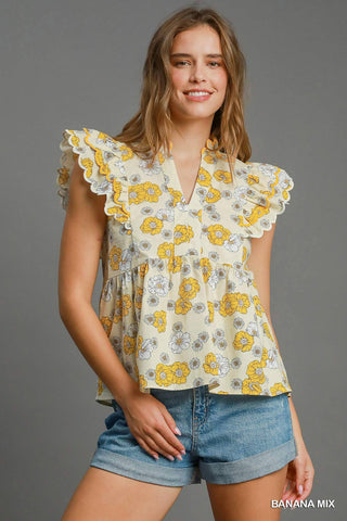 Floral print peplum top with scalloped sleeves and lined cotton fabric for women | JSQ Mercantile – a women’s boutique and gift shop in La Grange, IL.